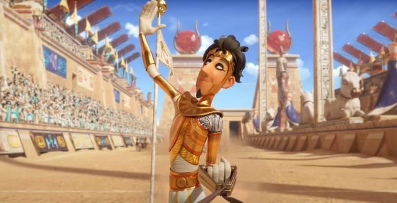 Karakter fra filmen i gladiatoruniform som holder opp armen.